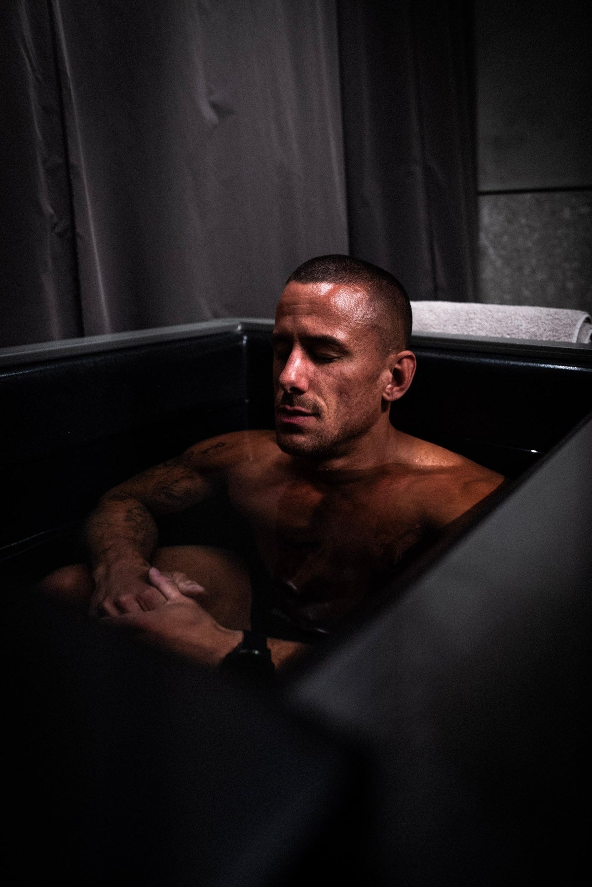 man recovering in ice bath